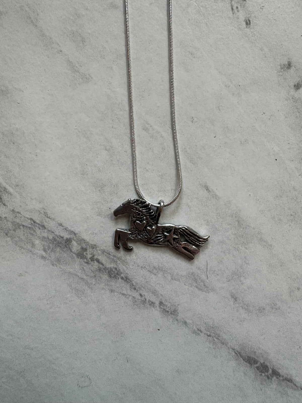 celestial colt necklace